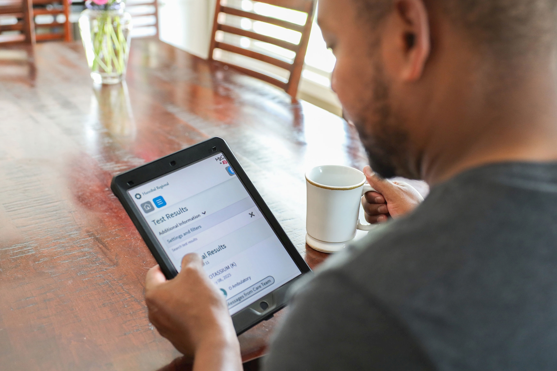Patient looking at their patient portal on a tablet